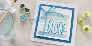 Ideen für Glückwünsche und Grußkarten: Ein Geschenk für dich | Quadratische Karte mit aquarelliertem Geschenkkarton, Schleife und gestempeltem Schriftzug